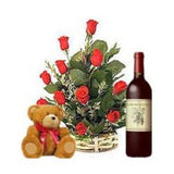 Basket of twelve red roses with wine and bear