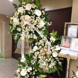 Three levels of anthuriums and orchids